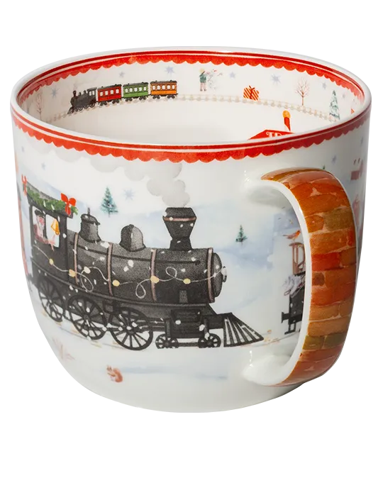 Side view of a Winter Express mug showing a black steam locomotive decorated with lights and a brick-patterned handle.