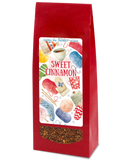 Red package of 'Sweet Cinnamon' tea with a colorful label on a white background
