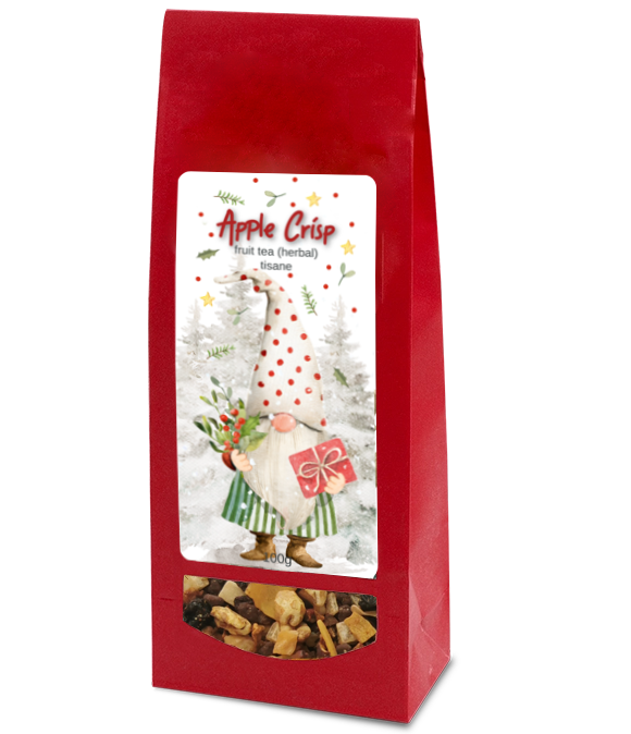 Apple Crisp herbal fruit tea in a red bag with a festive gnome label and a clear window showing the loose tea blend.