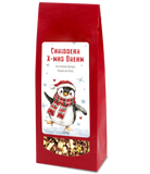 Caribbean Xmas Dream herbal fruit tea, 100g, in a red bag with a festive penguin label and clear window showing the blend. 