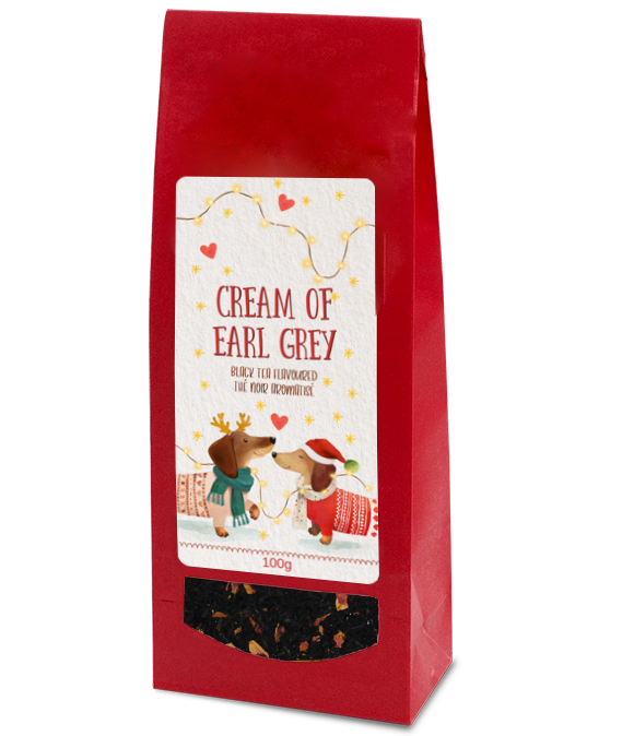 Cream of Earl Grey black tea, 100g, in a red bag with two festive dachshunds on the label and a clear window showing the tea.