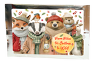 Tea greeting card with animals in winter clothing and the message “Warm Wishes this Christmas to YOU!” in silver packaging.