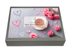 A square gray box for a tea sampler, shown at an angle on a white background. The lid features a printed design with pink roses, pink and white hearts on a light gray background, and a central label reading 'tea desire tea sampler no 2 pre-portioned love leaf tea'.