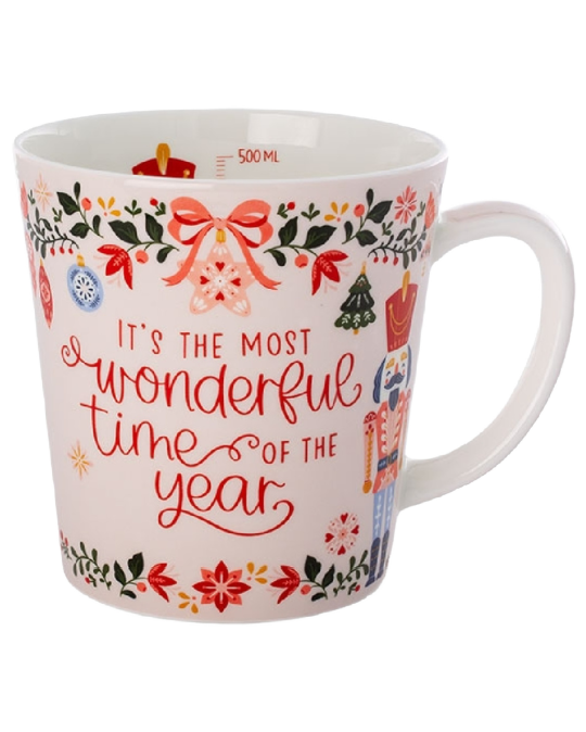 White Christmas mug with “It’s the most wonderful time of the year” in red lettering, surrounded by nutcrackers, bows, ornaments, and festive foliage.