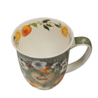 Mug with floral and fruit design on a white background