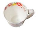 Floral-patterned ceramic mug on a white background