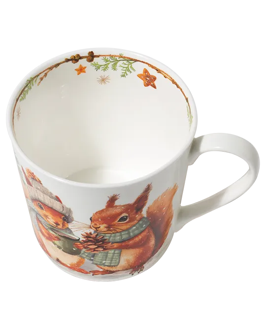 Top view of a squirrel mug showing a branch border with evergreen sprigs and hanging stars around the inside rim.