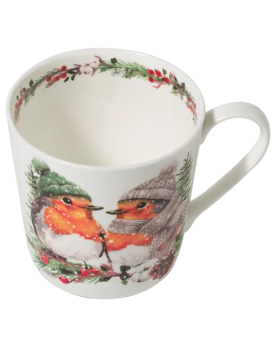 Top view of a robin mug showing evergreen foliage and red berries around the inner rim, with two winter robins illustrated outside.