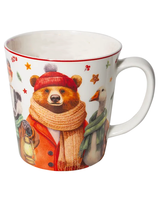 White mug with a red rim featuring a bear in a red winter hat and coat, wearing a scarf and holding a lantern.