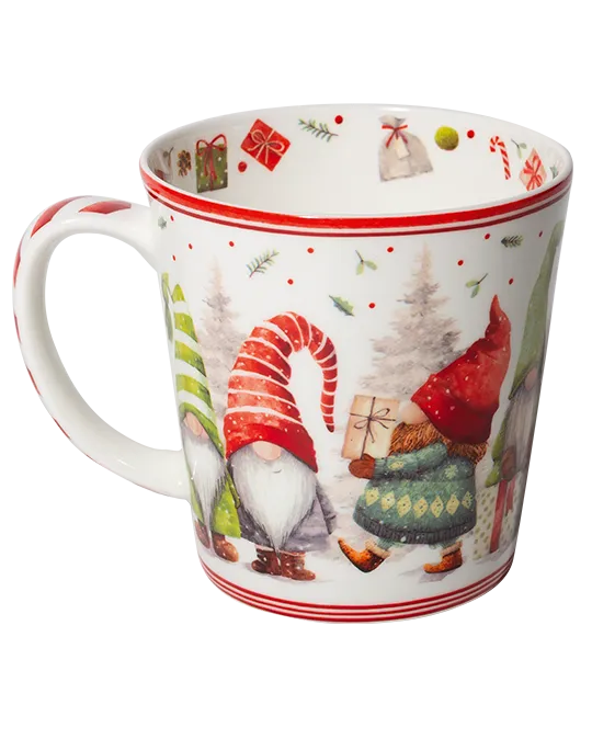 White Christmas mug featuring gnomes in red hats, one carrying a wrapped gift, with red striped borders and festive decorations inside the rim.