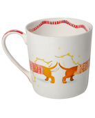 Reverse view of a white mug showing the dachshunds’ tails and patterned jumpers, with golden fairy lights and a striped border inside.