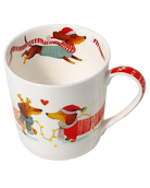 Top view of a dachshund mug showing a dog in a Santa hat and teal jumper with a flowing red-and-white scarf inside the rim.
