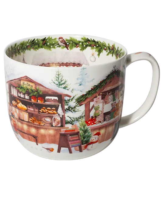 White jumbo mug featuring snowy wooden market stalls with baked goods and gifts, evergreen trees, and a green garland inside the rim.