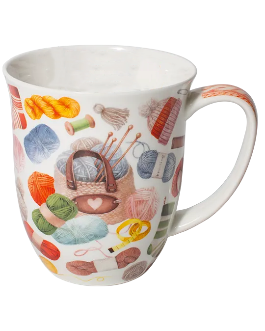 White mug decorated with colourful balls of yarn, knitting needles, and a knitting bag with a heart detail.