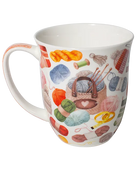 White mug decorated with colourful balls of yarn, knitting needles, and a knitting bag with a heart detail.