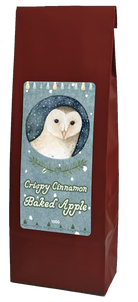 Crispy Cinnamon Baked Apple tea, 100g, in a burgundy bag with a winter-themed label featuring a barn owl.