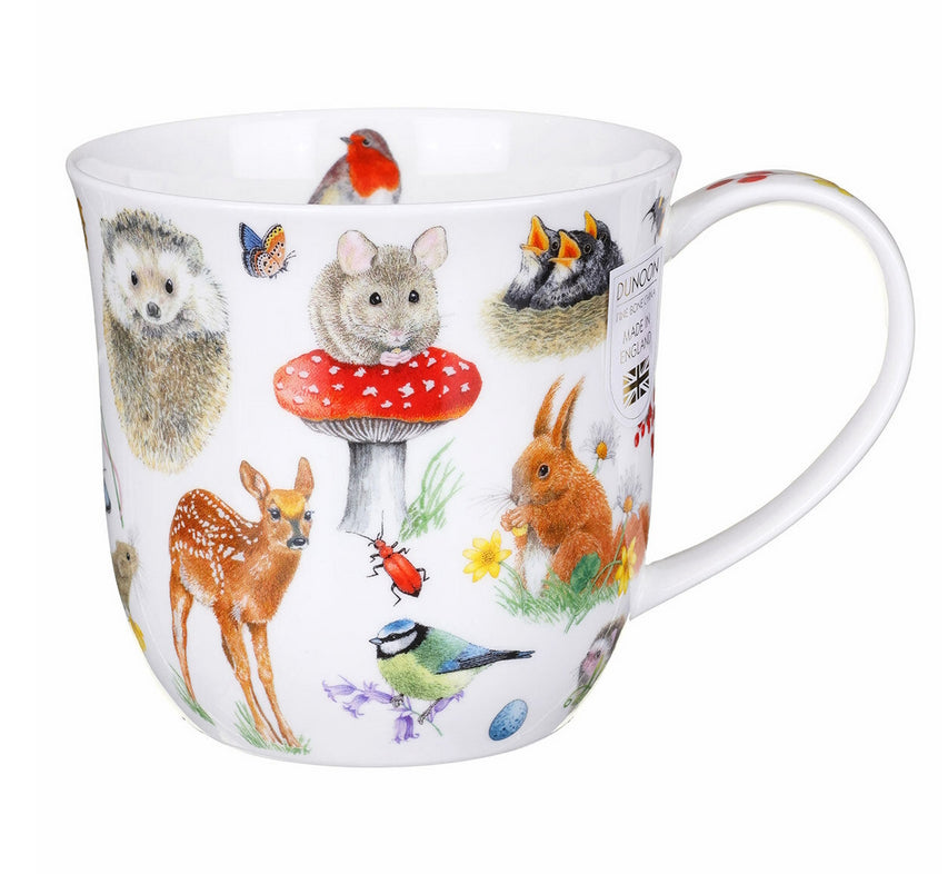 White mug with colourful animal illustrations on a white background