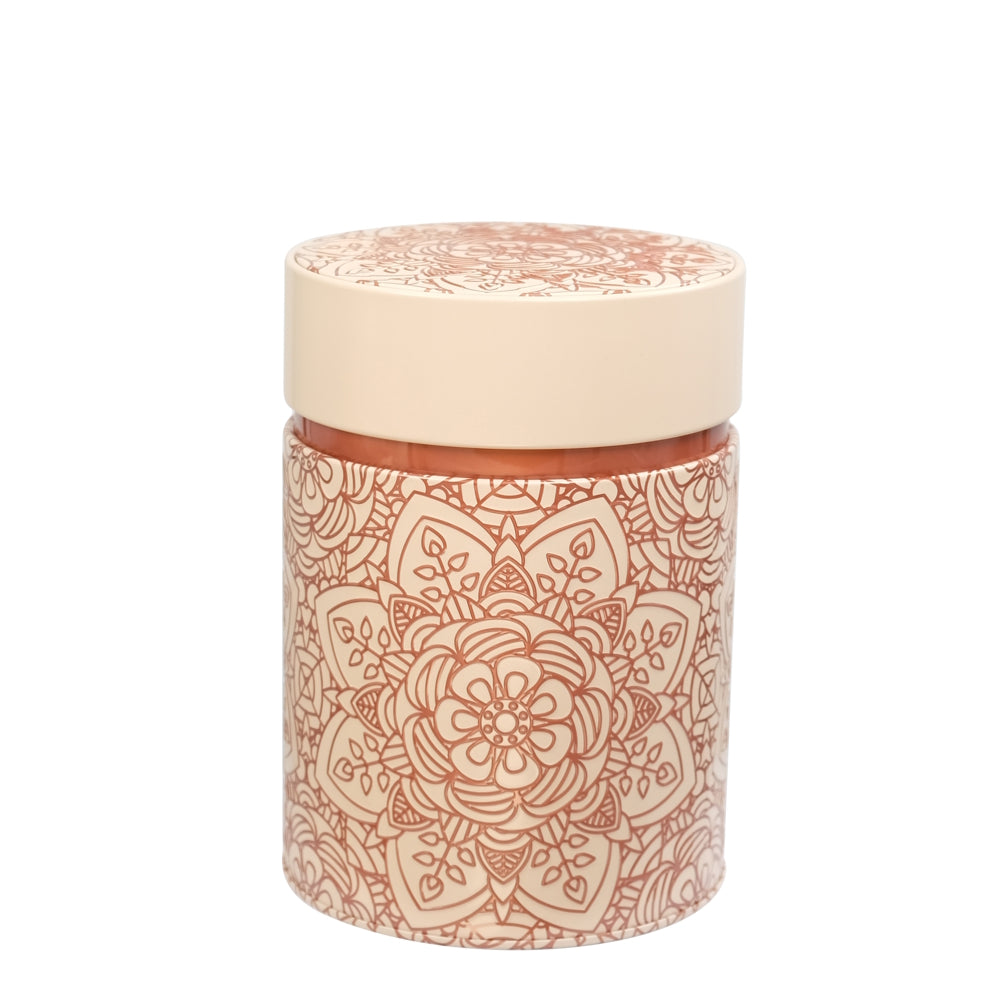 Decorative cylindrical container with a patterned design on a beige background