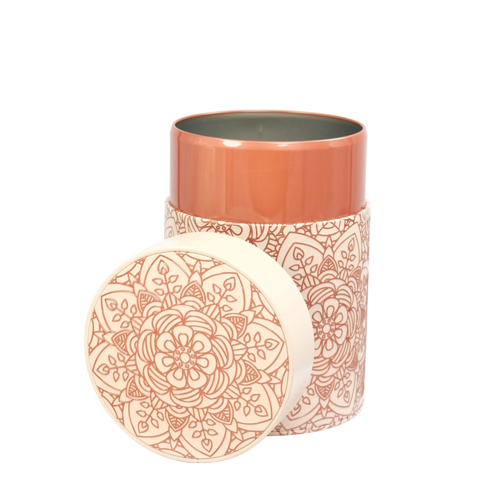 Decorative patterned container on a beige background with opened lid