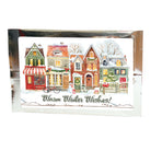 Card with winter scene of houses and 'Warm Winter Wishes' text