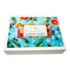 Tea Desire cold brew sampler packaging with fruit and ice design on a white background