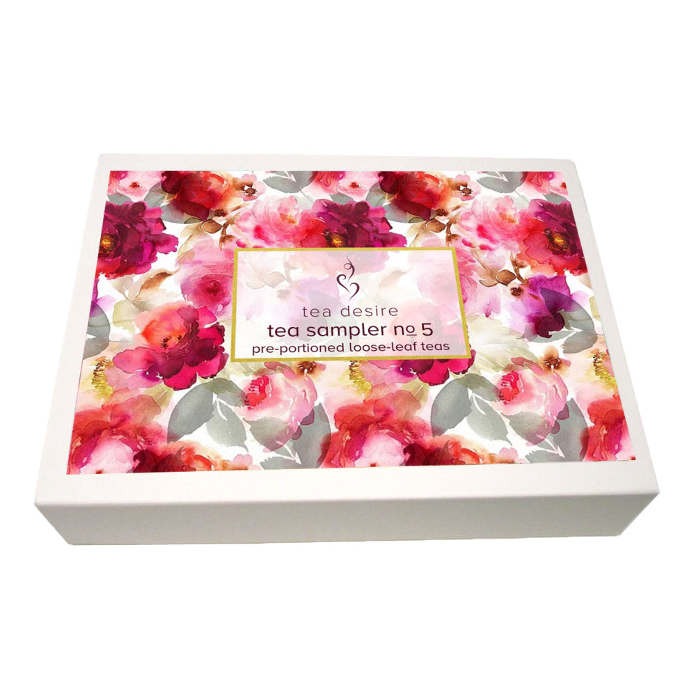 Tea sampler box with floral design on a white background