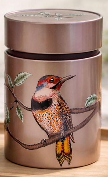 Metal canister with a bird illustration on a branch