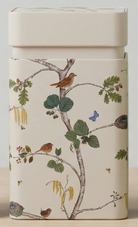 Container with nature-themed design featuring birds and trees on a beige background