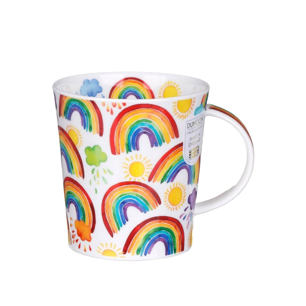 A white fine bone china mug decorated with a colourful pattern of hand-painted-style rainbows, yellow suns, green clovers, and small blue clouds. 